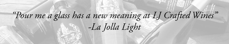 Background image showing various bottles of wine in a jumble. Text: "Pour me a glass has a new meaning at LJ Crafted Wines: - La Jolla Light.